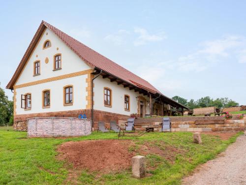 a large white house on a grass field at Holiday Home Dolní Olešnice by Interhome in Horní Olešnice