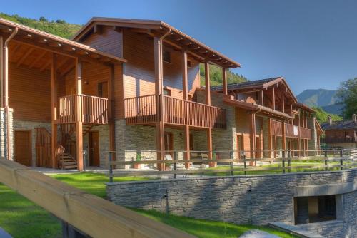 a log home with balconies on the side of it at Borgo Fantino - Residenze e Alloggi Vacanza in Limone Piemonte