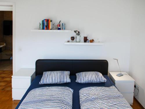 Postel nebo postele na pokoji v ubytování Apartment San Quirico by Interhome