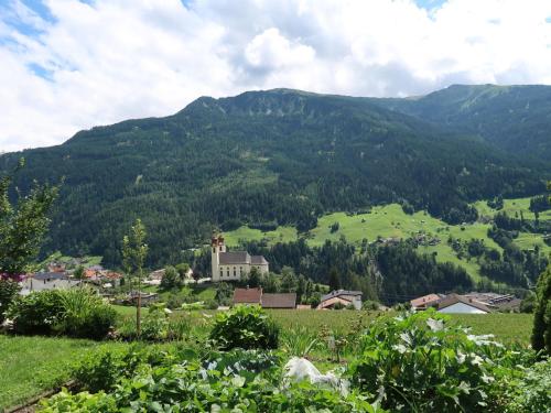 a village in a valley with mountains in the background at Apartment Appart Vroni by Interhome in Fliess