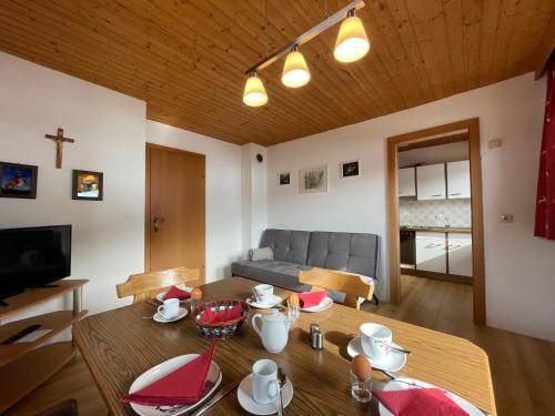 a living room with a table and a couch at Apartment Jaggler by Interhome in Dorf