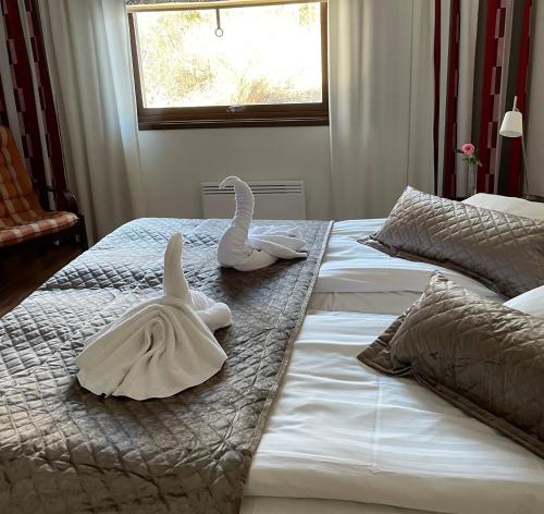 
Säng eller sängar i ett rum på Eckerö Hotell & Restaurang
