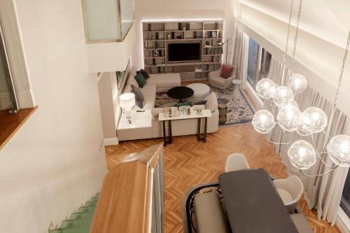 an aerial view of a living room with a couch at InterContinental Porto - Palacio das Cardosas by IHG in Porto