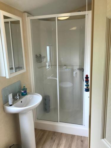 a bathroom with a shower and a sink at Seascape in St Andrews
