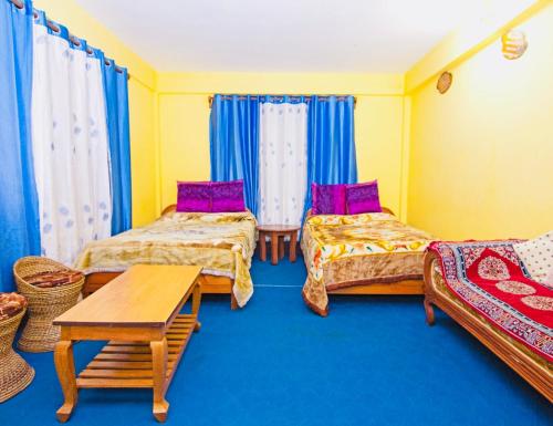 Postel nebo postele na pokoji v ubytování Dew Drop Homestay