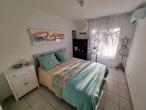 Posteľ alebo postele v izbe v ubytovaní Cap Capistol Golf, appartement 2 chambres