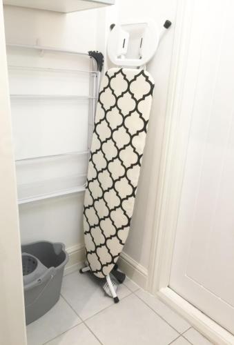 a dressmaker standing next to a door at Bedford Rd Apartment Ideal for Hospital & Town Centre in Kempston