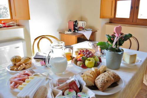 a table with a bunch of food on it at Alba su Assisi in Petrignano