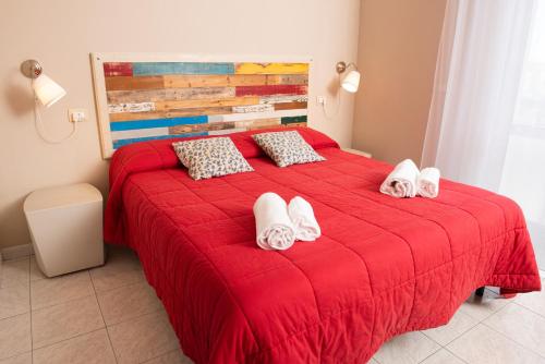 Ένα ή περισσότερα κρεβάτια σε δωμάτιο στο Hostal Al Porto