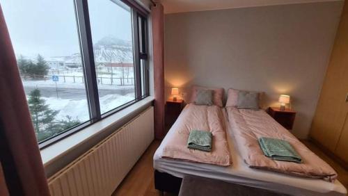 Säng eller sängar i ett rum på Kirkjufell central apartment