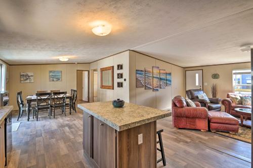 a living room with a couch and a table at 3 Mi to Beach Home with Deck in Port OConnor! in Port O'Connor