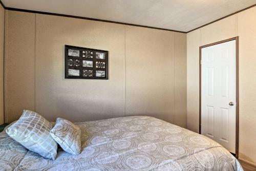 a bedroom with a bed with two pillows on it at 3 Mi to Beach Home with Deck in Port OConnor! in Port O'Connor