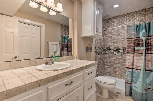 a bathroom with a sink and a toilet and a shower at Idyllic Montgomery Condo with Pool and Lake View! in Montgomery