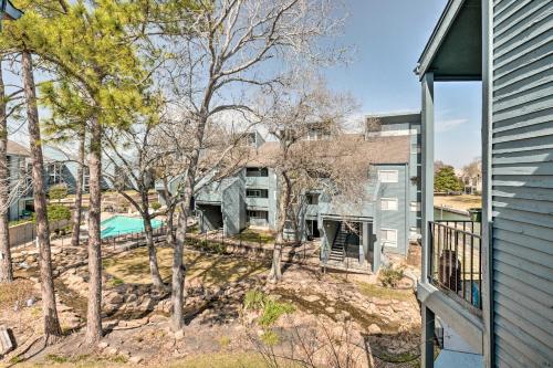 an exterior view of a house with a pool and trees at Idyllic Montgomery Condo with Pool and Lake View! in Montgomery