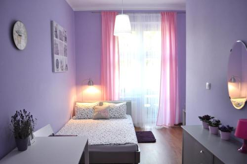 Ένα ή περισσότερα κρεβάτια σε δωμάτιο στο Happy House Hostel
