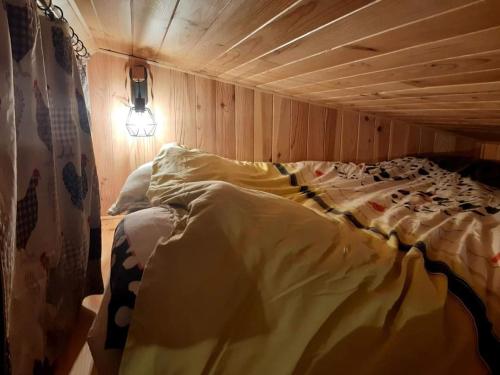 Postel nebo postele na pokoji v ubytování tiny house