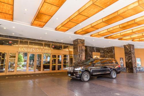 a limo parked in front of a building at Golden Nugget Hotel & Casino Las Vegas in Las Vegas