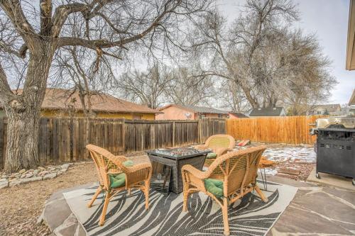 a patio with a table and chairs and a fence at 5 minutes to downtown and just minutes to military and hospitals in Colorado Springs