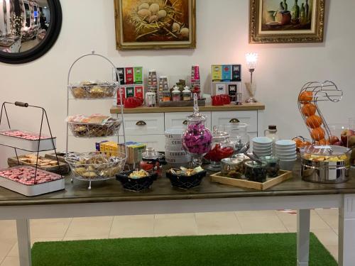 a buffet of food on a table at Hotel Restaurant Baryton in Saint-Marcel