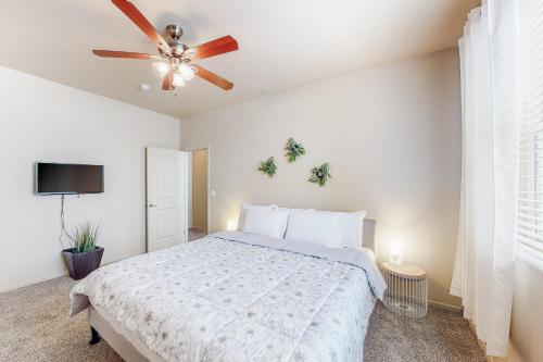 a bedroom with a bed and a ceiling fan at Pikes Peak West in Flagstaff