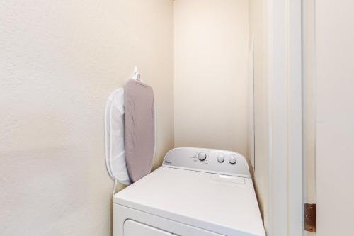 a laundry room with a washer and dryer at Pikes Peak West in Flagstaff