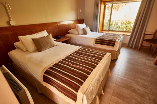 Postel nebo postele na pokoji v ubytování Hotel La Casa de Don Tomás
