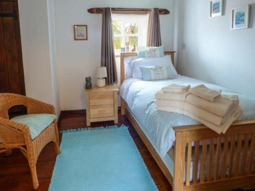 Un pat sau paturi într-o cameră la Bramhill Barns