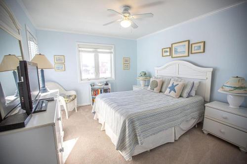 Voodi või voodid majutusasutuse Feelin' Beachy-7A toas