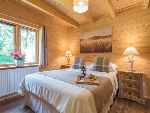 Ένα ή περισσότερα κρεβάτια σε δωμάτιο στο Hampton Lodge