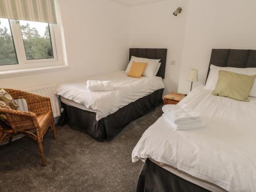 Кровать или кровати в номере Thompson Cottage