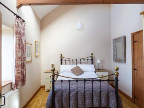 a bedroom with a large bed in a room at Y Wylan in Holyhead