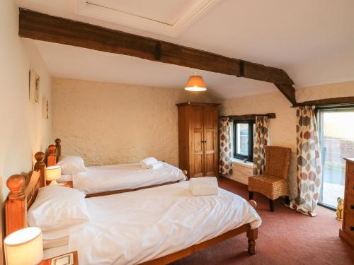 Postel nebo postele na pokoji v ubytování Carthorse Cottage