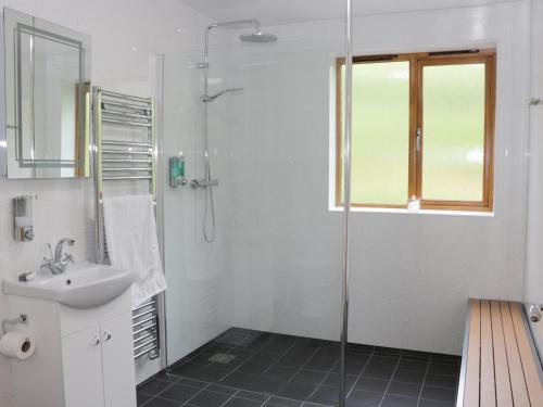a bathroom with a sink and a shower at Rolling Hills in Newcastle
