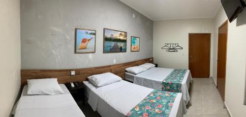 Ένα ή περισσότερα κρεβάτια σε δωμάτιο στο Hotel Casa Grande