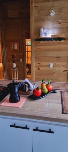 a kitchen counter with tomatoes on a cutting board at EcoChalet Luxury in Ráquira