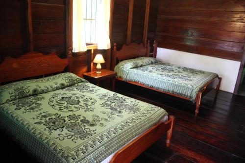 Ein Bett oder Betten in einem Zimmer der Unterkunft Coloso del Mar
