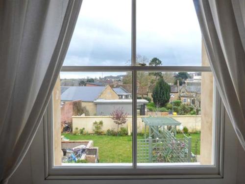an open window with a view of a yard at East Wing in Crewkerne
