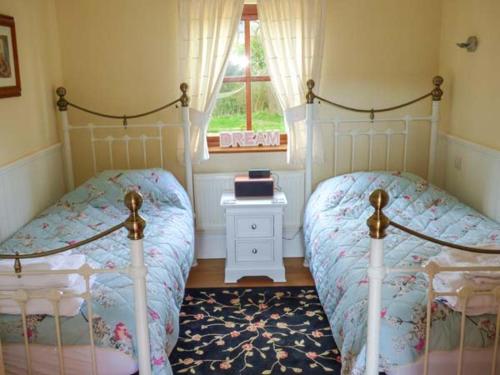 Voodi või voodid majutusasutuse Stable Cottage toas