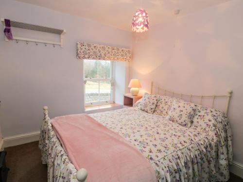 Voodi või voodid majutusasutuse Miners Cottage toas