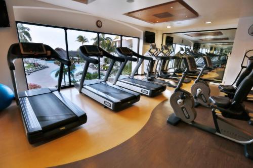 a gym with a bunch of treadmills at The Royal Cancun All Suites Resort in Cancún