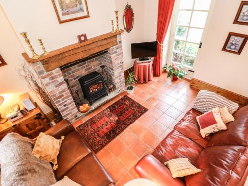 an overhead view of a living room with a fireplace at The Old Chapel in Chesterfield