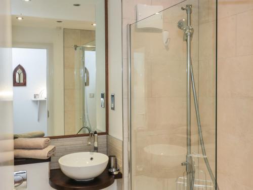 a bathroom with a sink and a shower at 6 Mill Wharf in Berwick-Upon-Tweed