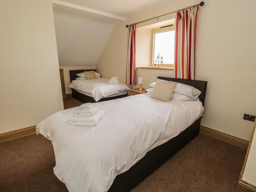 En eller flere senge i et værelse på Newton View