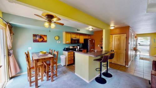 a kitchen and dining room with a table and chairs at Adventure Villa #3282 in Moab