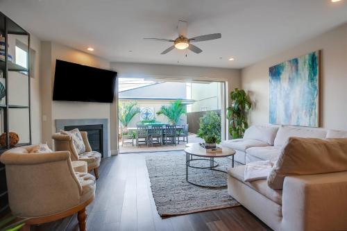 a living room with a couch and a fireplace at Opal Oasis in San Diego
