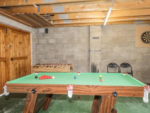 a ping pong table in a room with at Dolce Casa in Grantown on Spey