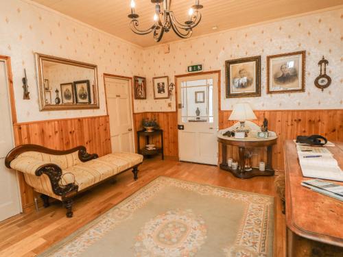 a living room with a couch and a table at Cairbre House in Dungarvan