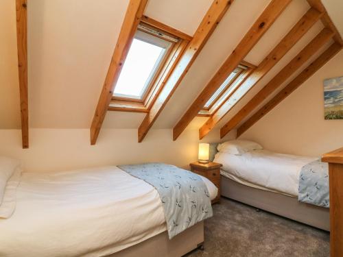 Postel nebo postele na pokoji v ubytování Rose Cottage