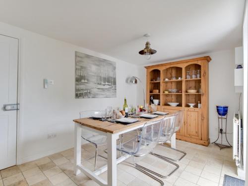 a dining room with a table and chairs at Fenders in Weymouth