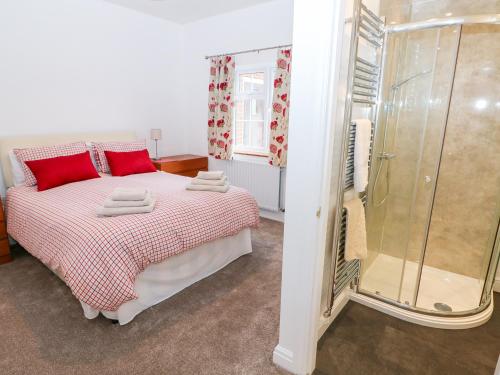 a bedroom with a large bed and a shower at Balmedie in Market Rasen